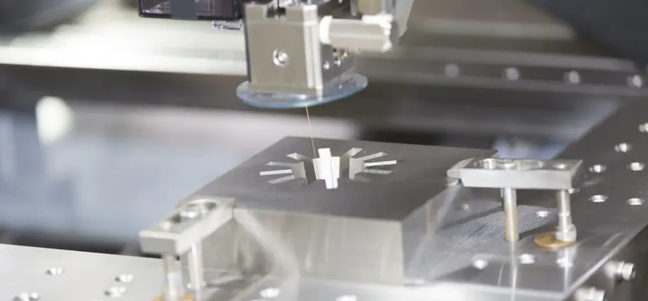 Precision EDM machining a metal workpiece