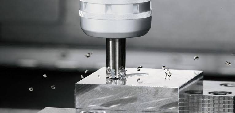 Plain milling operation on a horizontal milling machine cutting a flat metal surface